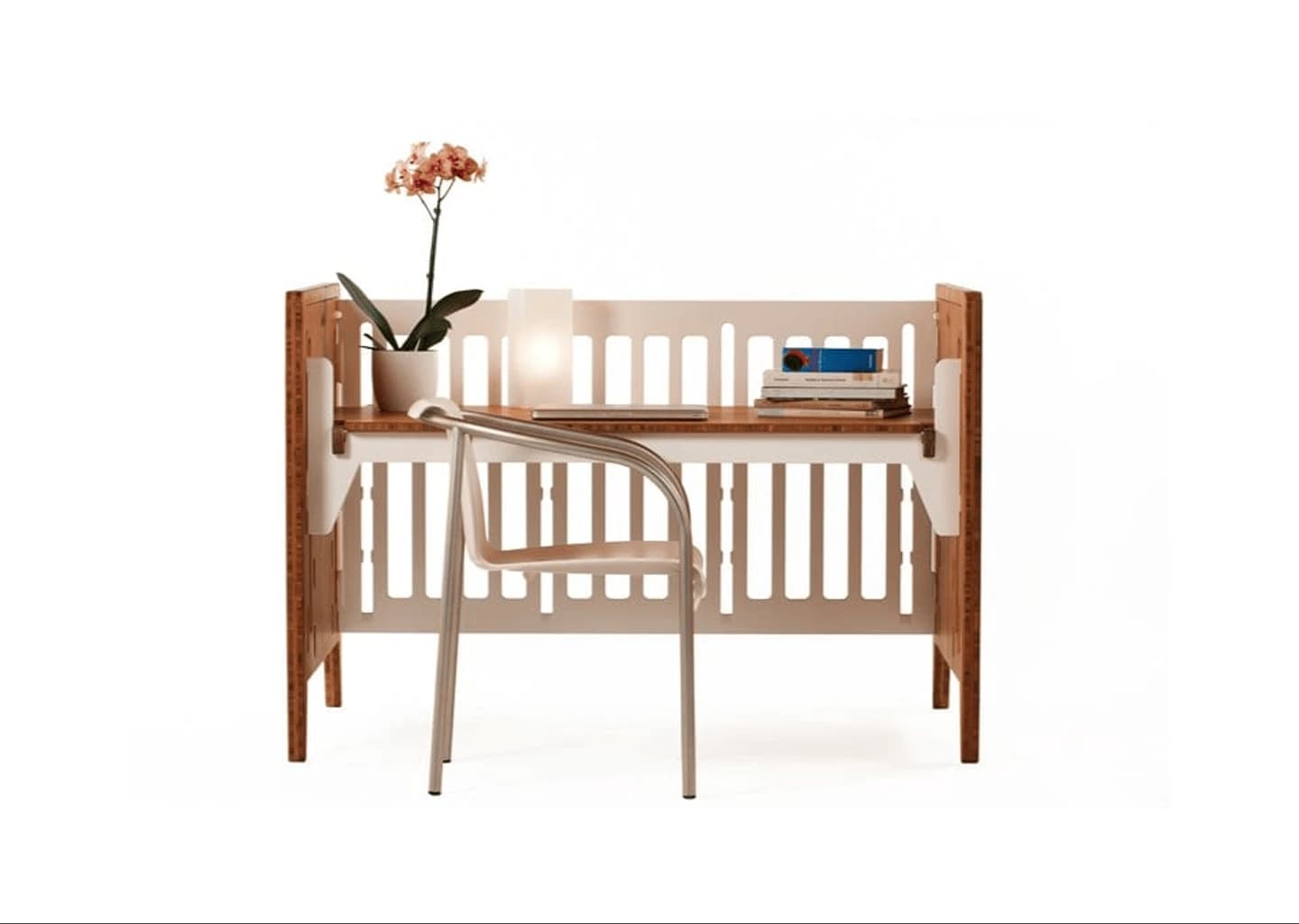 Crib brand product still: a bamboo desk with chair, lamp, and orchid on a white sweep.