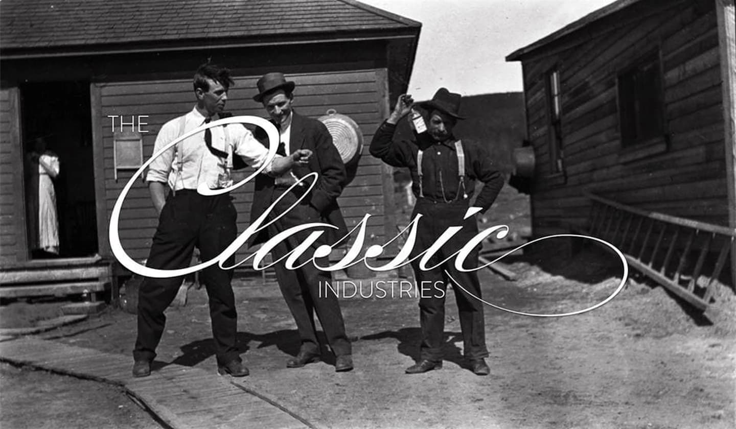 Classic Industries logotype over a vintage black-and-white photograph of three men.