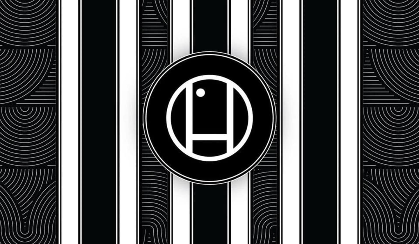 Huntridge circular monogram on a black-and-white striped art-deco pattern.