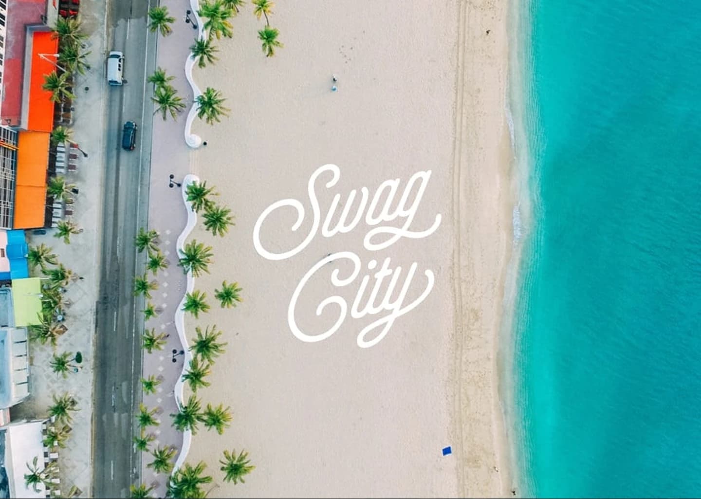 Aerial Swag City brand mark dropped onto a tropical beach with palm trees and turquoise water.