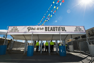 Crowd and stage moment from Life is Beautiful, the brand system applied across the surrounding signage.