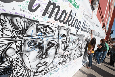 Attendees gathered in a Life is Beautiful festival zone, the brand reading at city-scale around them.