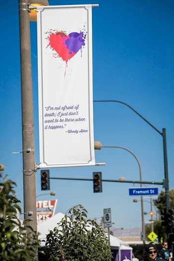 Crowds, art, and environmental brand work converging inside the Life is Beautiful festival footprint.