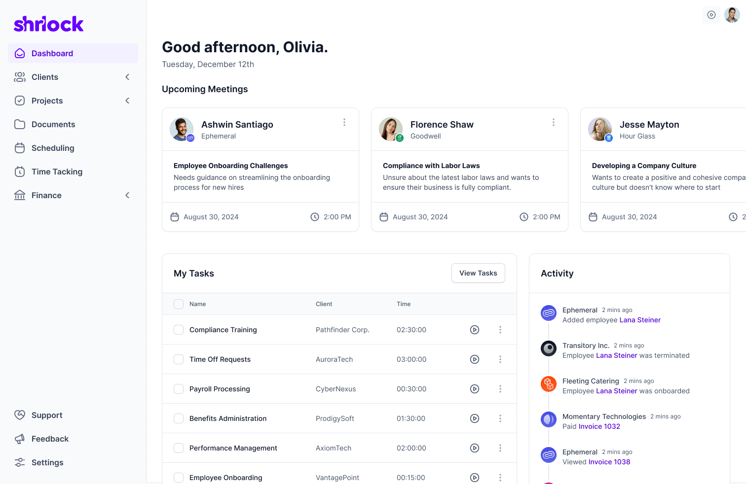 The Shrlock cross-client dashboard, with upcoming meetings as a horizontal card row across the top, a my-tasks table grouped by client, and a live activity feed of employees onboarded, terminated, and invoices paid down the right rail.
